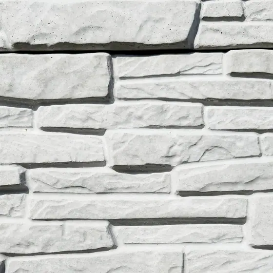 White Heritage Stone texture on grey concrete, close-up