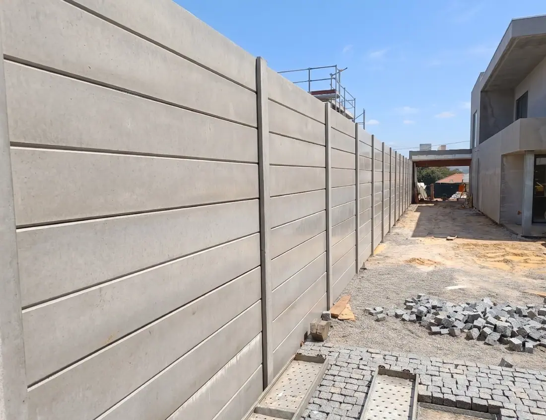 Long alignment of concrete wall two metres high
